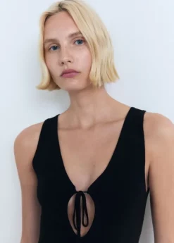 Knitted dress with bow neckline